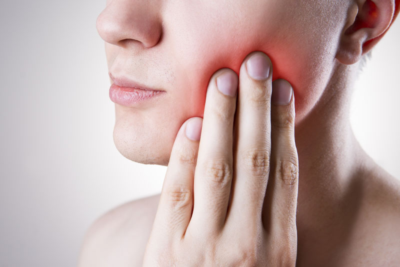 Dental Patient Suffering From TMJ Pain