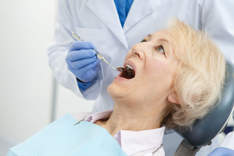 a dental implant patient undergoing full mouth implant procedure.