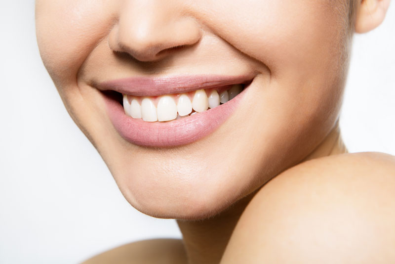 a smile makeover dental patient smiling.